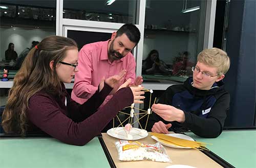 students working with ACE instructor