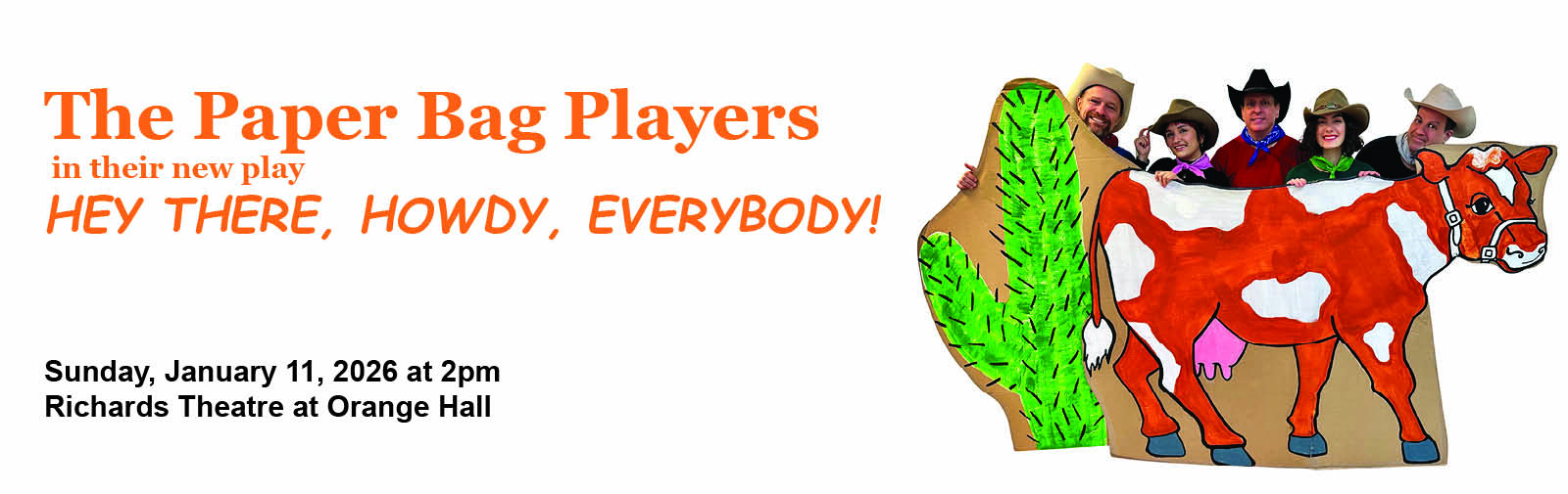 cast of the paper bag players smiling into camera dresses as cowboys behind a paper cow