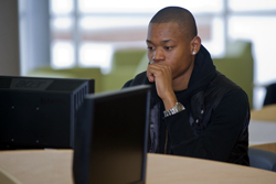 Photo of student at computer workstation