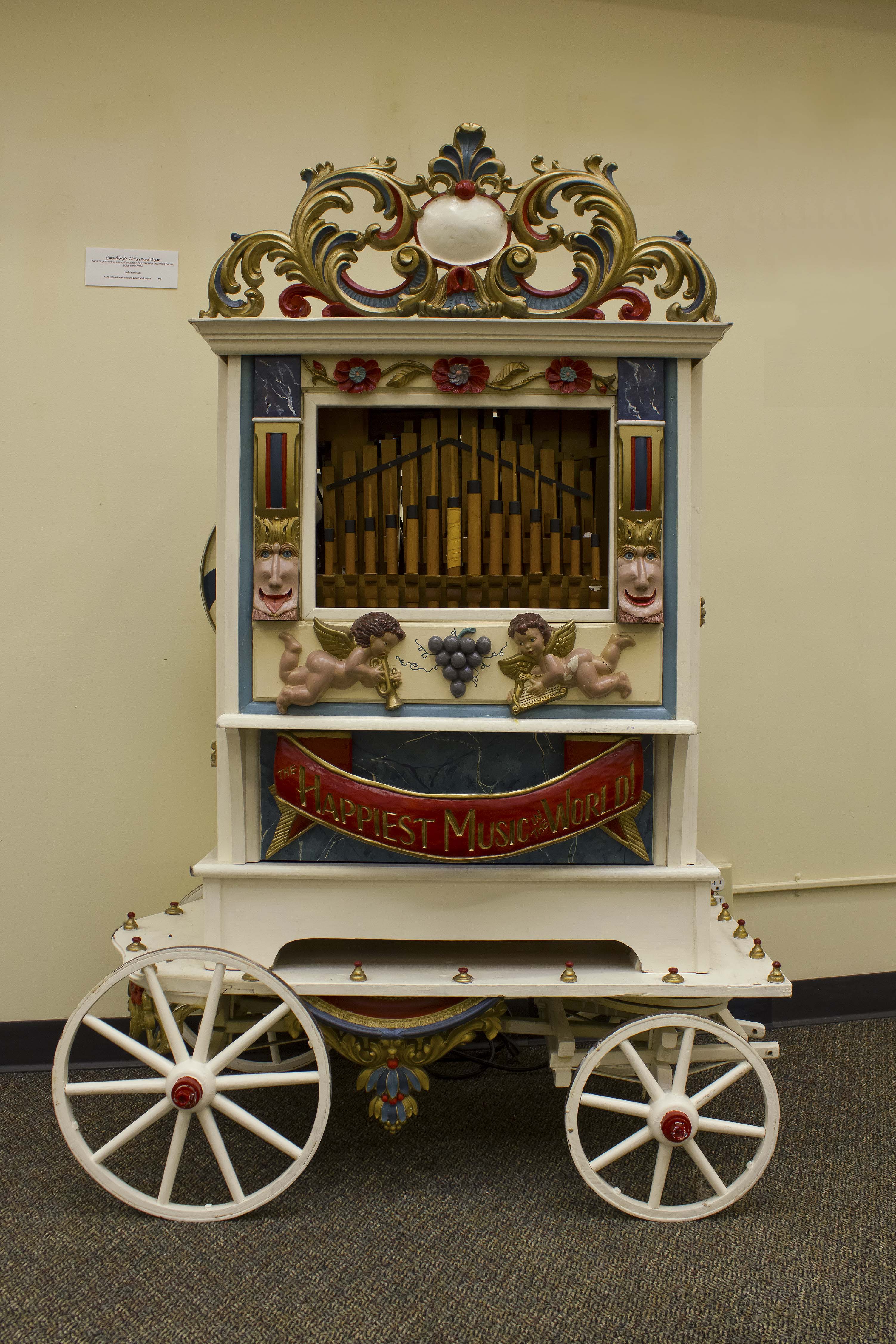 hand-carved and painted wood and pipes