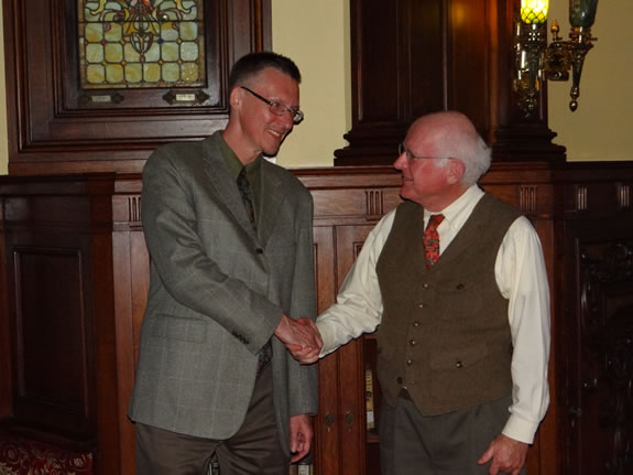 Paul Basinski, Global Studies chair and coordinator of Global Initiative: Africa, greets Dr. Richard Hull of New York University before his talk on October 9.