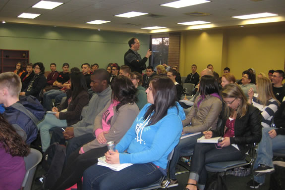 Picture of the lecturer among the audience