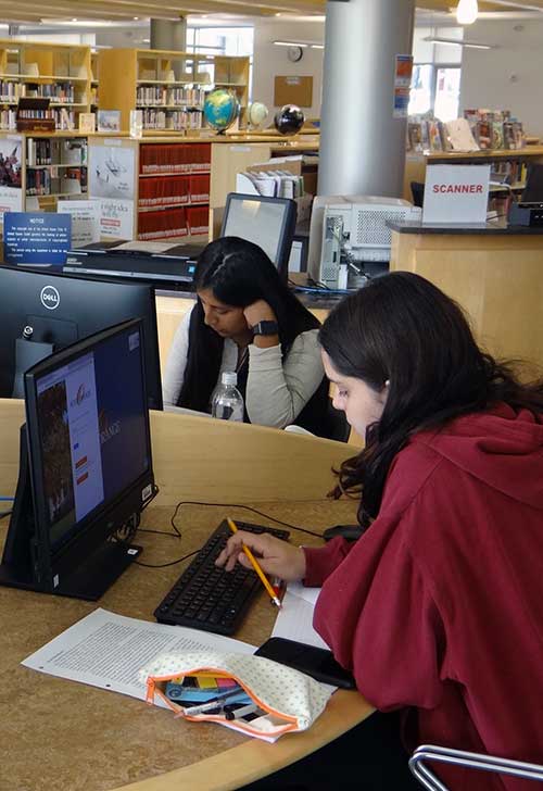 students in library