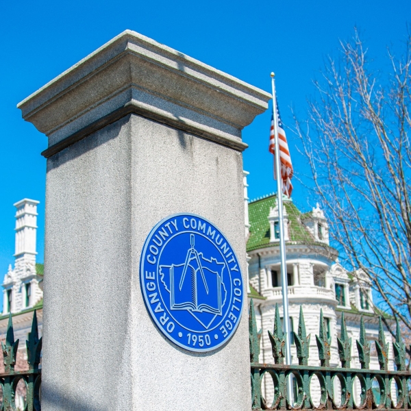 SUNY Orange seal on a pillar in front of Morrison Hall