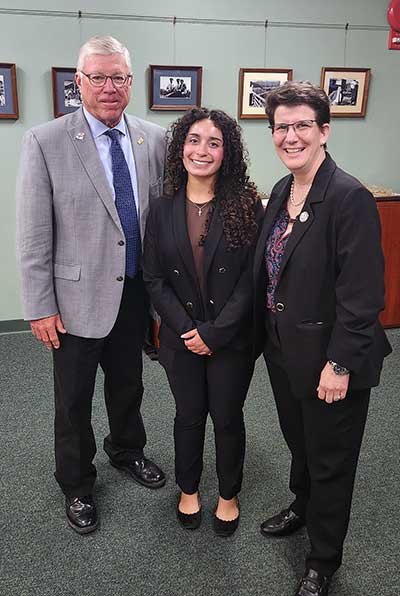 Arianna Rodriguez, center, with Tom Weddell and Dr. Kristine Young